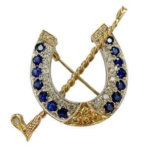 Spilla in oro 18kt con zaffiri, diamanti bianchi e gialli - Italia anni '80