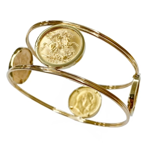 Rigid bracelet in 18 karat yellow gold with four British coins - Italy 1970s